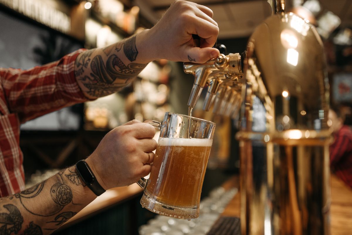 Bartender pouring a draught beer