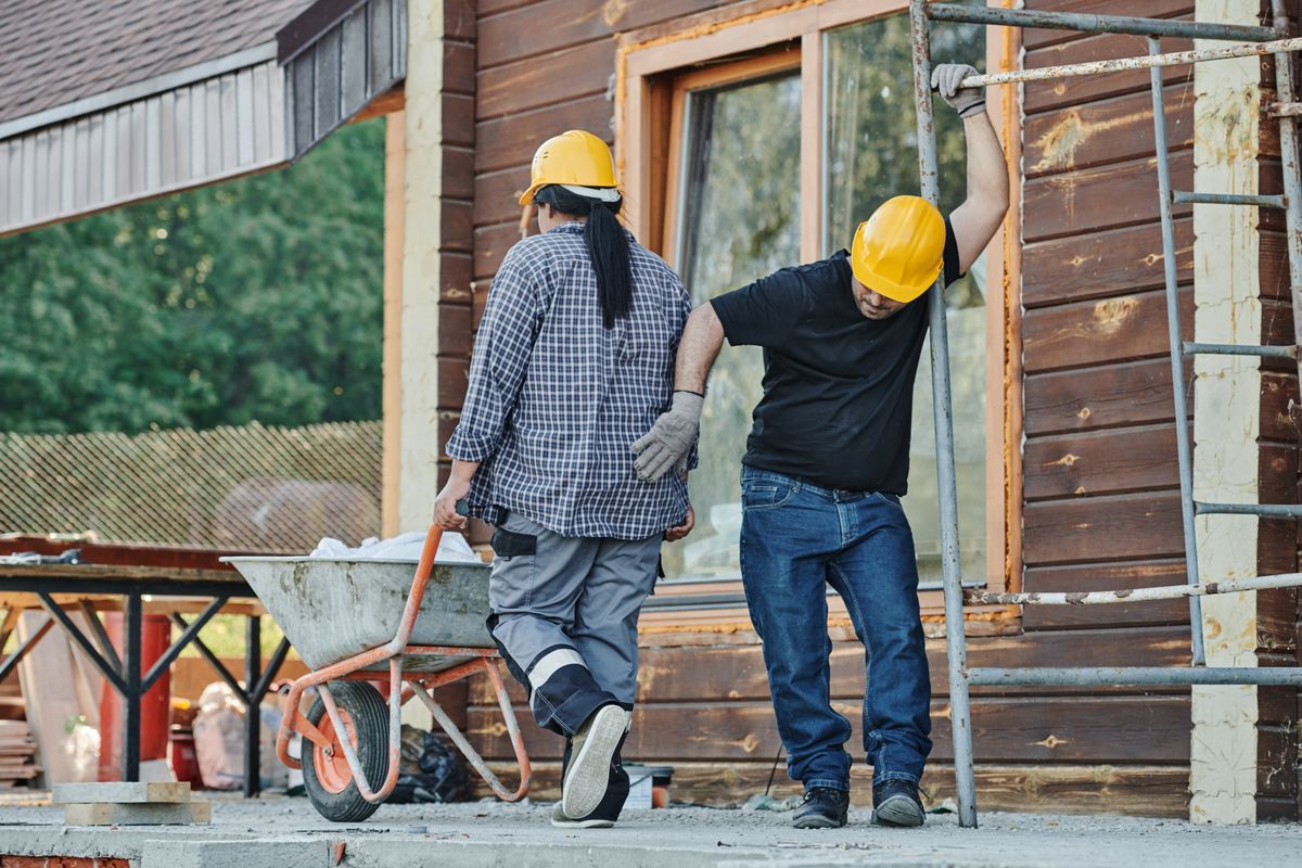 Construction workers in hard hats on site